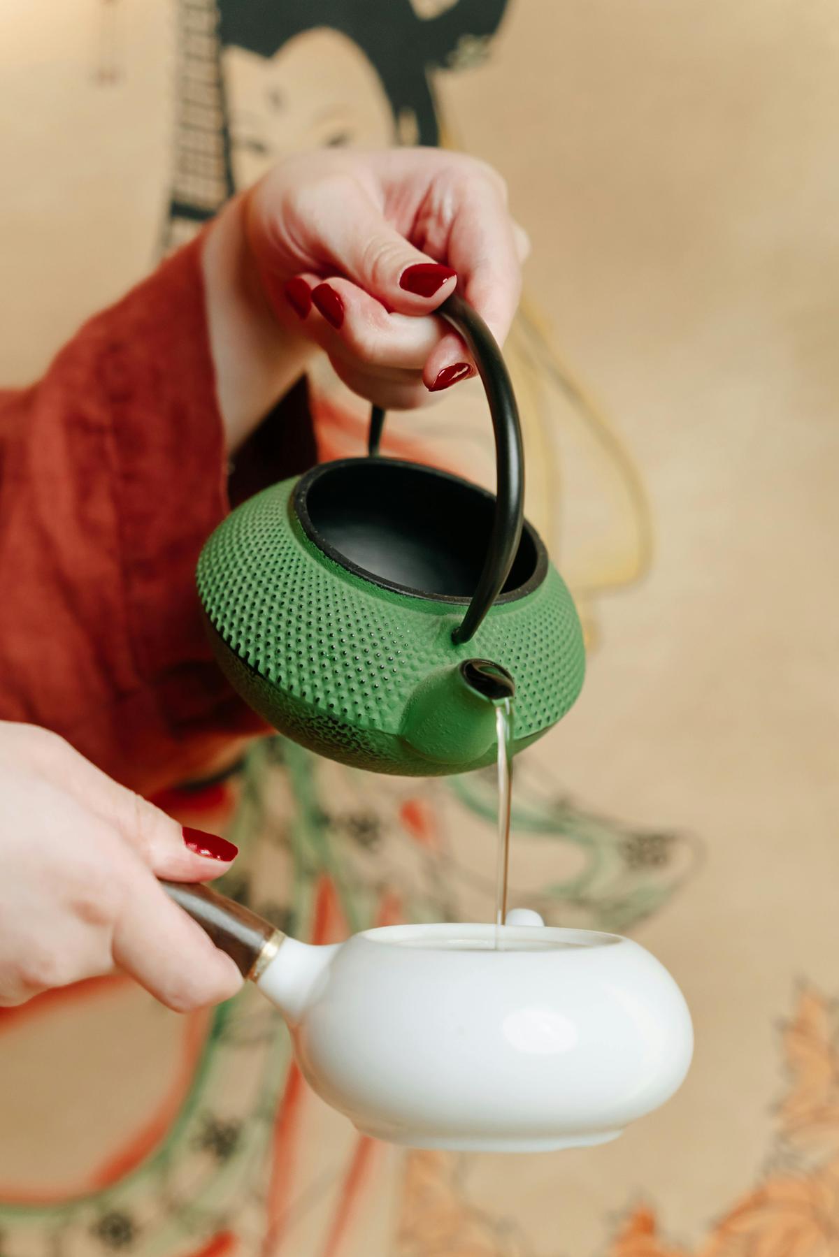 Pouring hot water over matcha powder